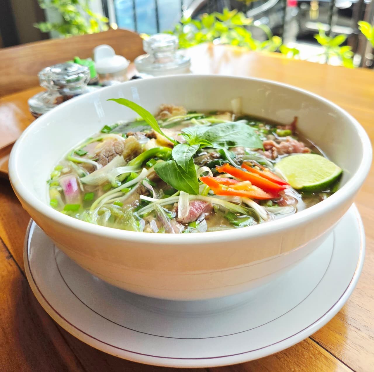 Phở bò at Tre Việt Nam — fresh bowl with herbs and chili